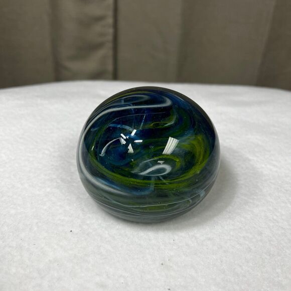 Clear glass round paperweight with blue and green swirls - Picture 4 of 7